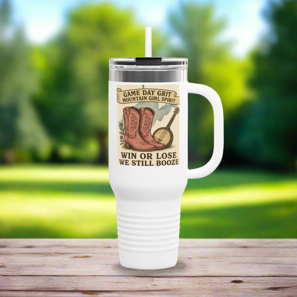 White travel mug with cowboy boots and banjo design on a label, featuring text.