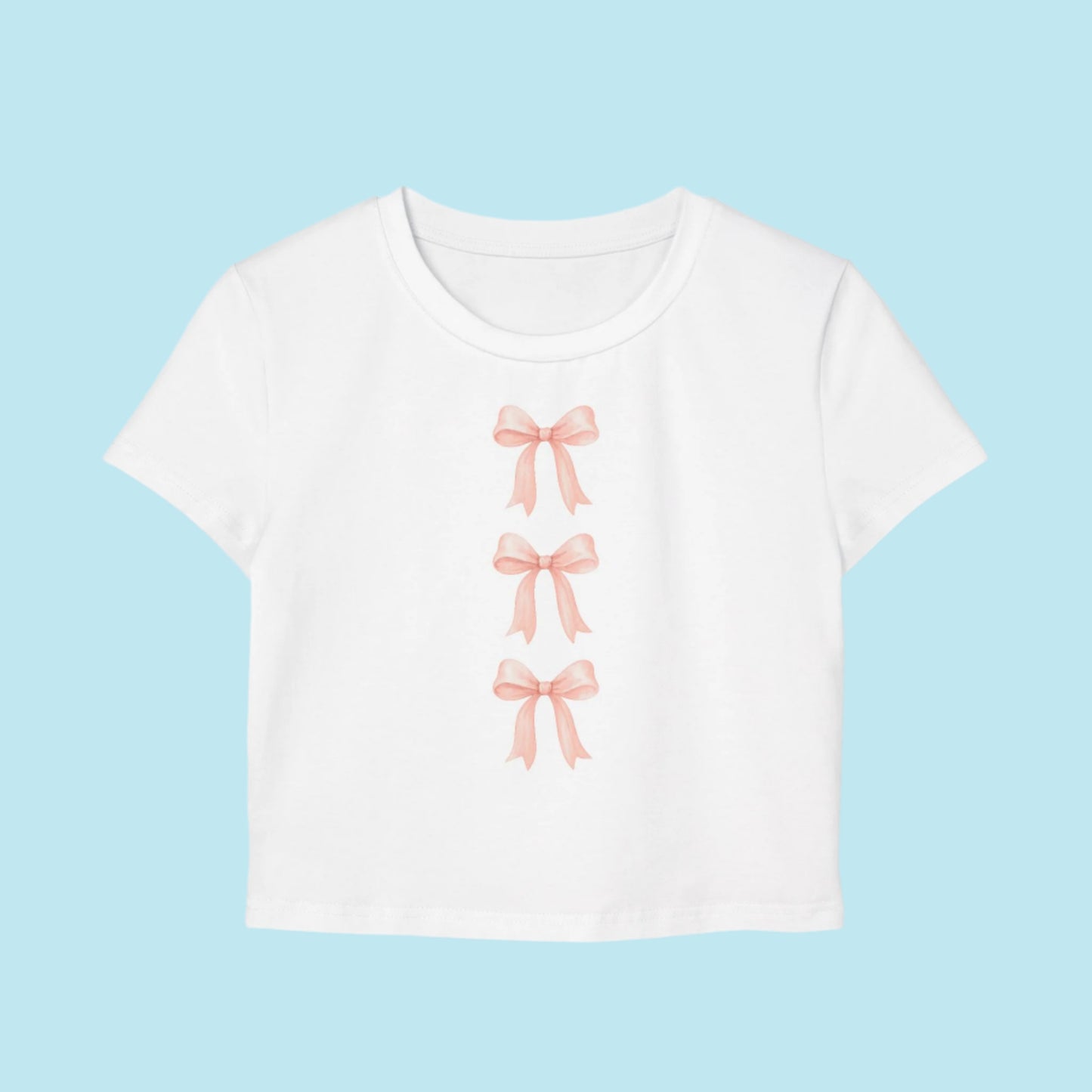 White t-shirt with pink bow designs on a white background Coquette style