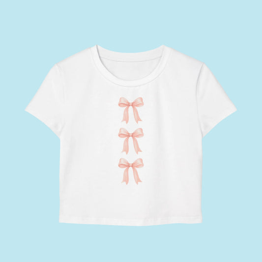 White t-shirt with pink bow designs on a white background Coquette style