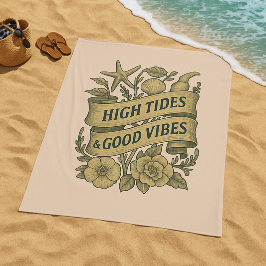 Beach towel with 'High Tides & Good Vibes' text on sand near ocean