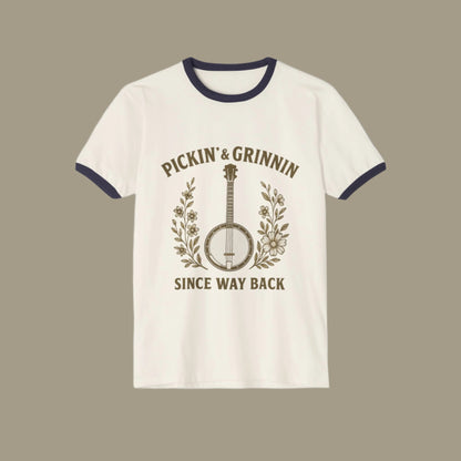 White t-shirt with black ringer design featuring a banjo and text on a white background