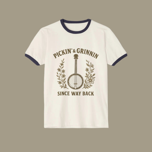 White t-shirt with black ringer design featuring a banjo and text on a white background