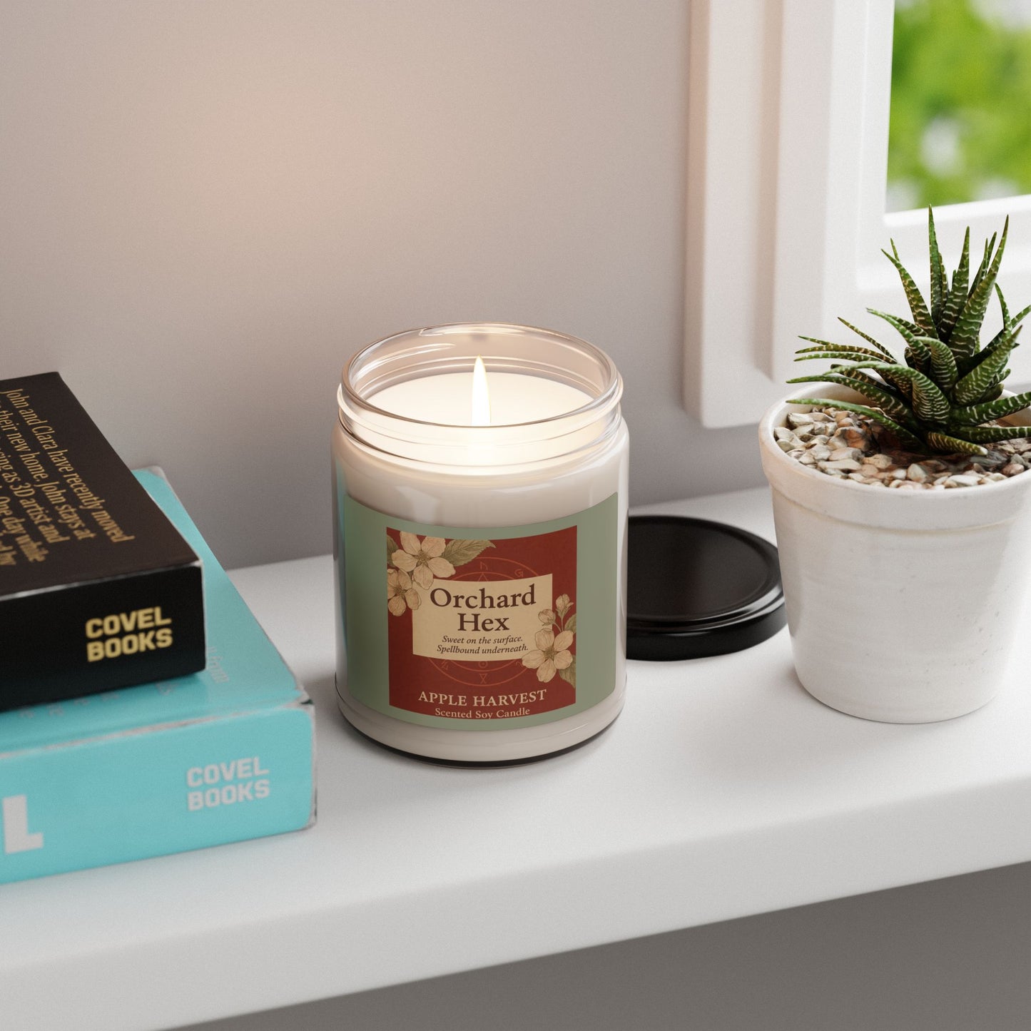 Scented Candle, Apple Harvest, Spellbound Soy Candle, 9oz - Sweet but spellbound, Deep red background with apple blossoms and a vintage