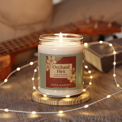 Scented Candle, Apple Harvest, Spellbound Soy Candle, 9oz - Sweet but spellbound, Deep red background with apple blossoms and a vintage