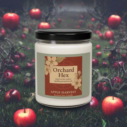 Scented Candle, Apple Harvest, Spellbound Soy Candle, 9oz - Sweet but spellbound, Deep red background with apple blossoms and a vintage