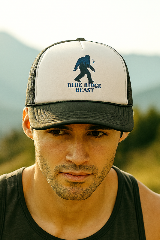 Man wearing a cap with 'Blue Ridge Beast' logo against a mountainous background